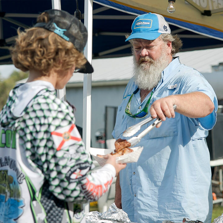 BLC Greg Serving BBQ